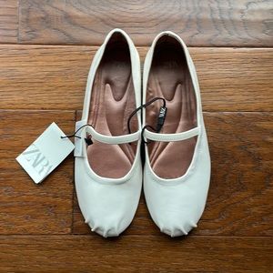 White ballet flats